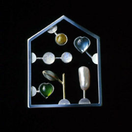 6.12 'Love Kit Green' 2002. Brooch; white metal, tourmaline, aquamarine, cultured pearl, moonstone, Iona marble, 18ct y gold