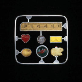 6.17 'Memory Kit' 2003. Brooch; white metal, mixed media, readymade