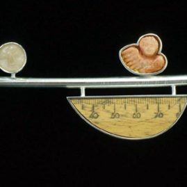 6.22 'Crossing II' 2000. Brooch; white metal, coral, wood, moonstone