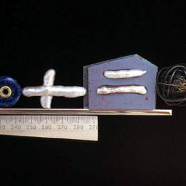 7.36 'Chaos Theory' 2003. Brooch; white metal, wood, paint, lapis lazuli, cultured pearl, 18ct y gold